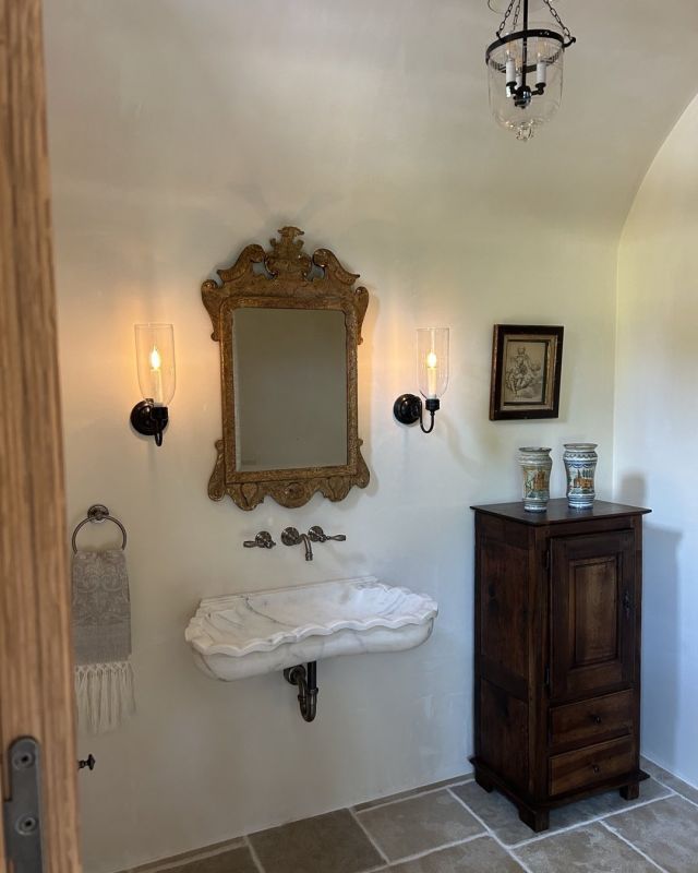 A powder room in a recently completed South Carolina project sporting some goodies from a few of our Nola favs. @wirthmoreantiques @balzac_antiques @macmaisonantiques #melissarufty